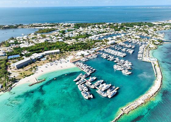 Illustrative Caribbean marina photograph accompanying August 2026 market coverage